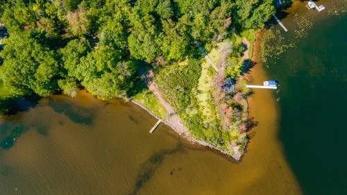 https://www.sundarbanexplore.com/wp-content/uploads/2025/08/beautiful-aerial-view-lake-surrounding-greenery-1.jpg