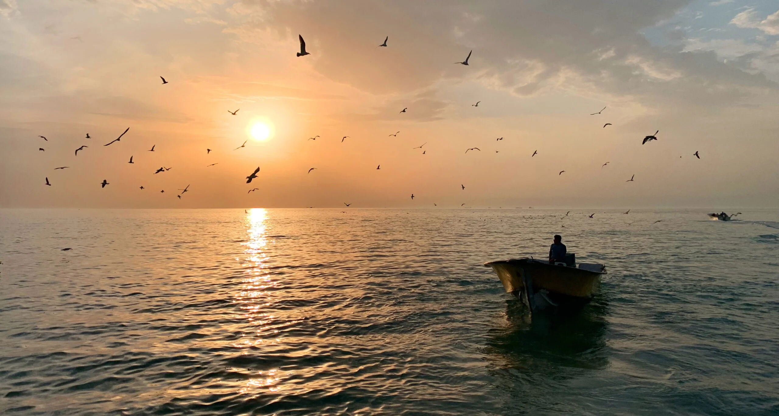 https://www.sundarbanexplore.com/wp-content/uploads/2025/12/male-small-rowboat-middle-beautiful-sea-with-sun-shining-scaled.jpg
